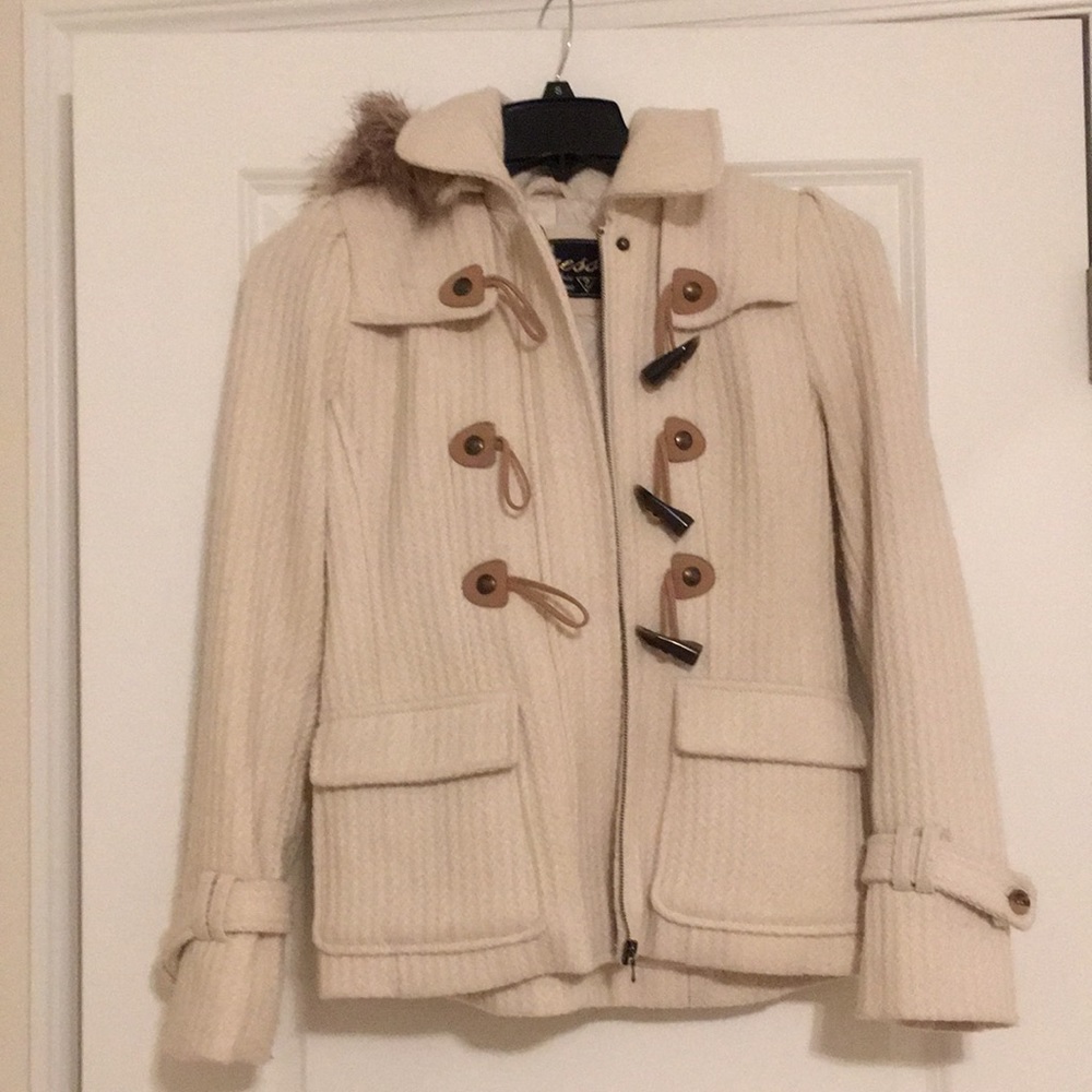 GUESS Size S cream colored winter coat with fur lined hood.